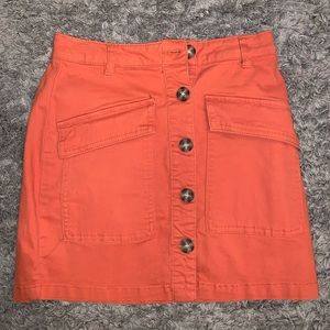 orange skirt with buttons down front